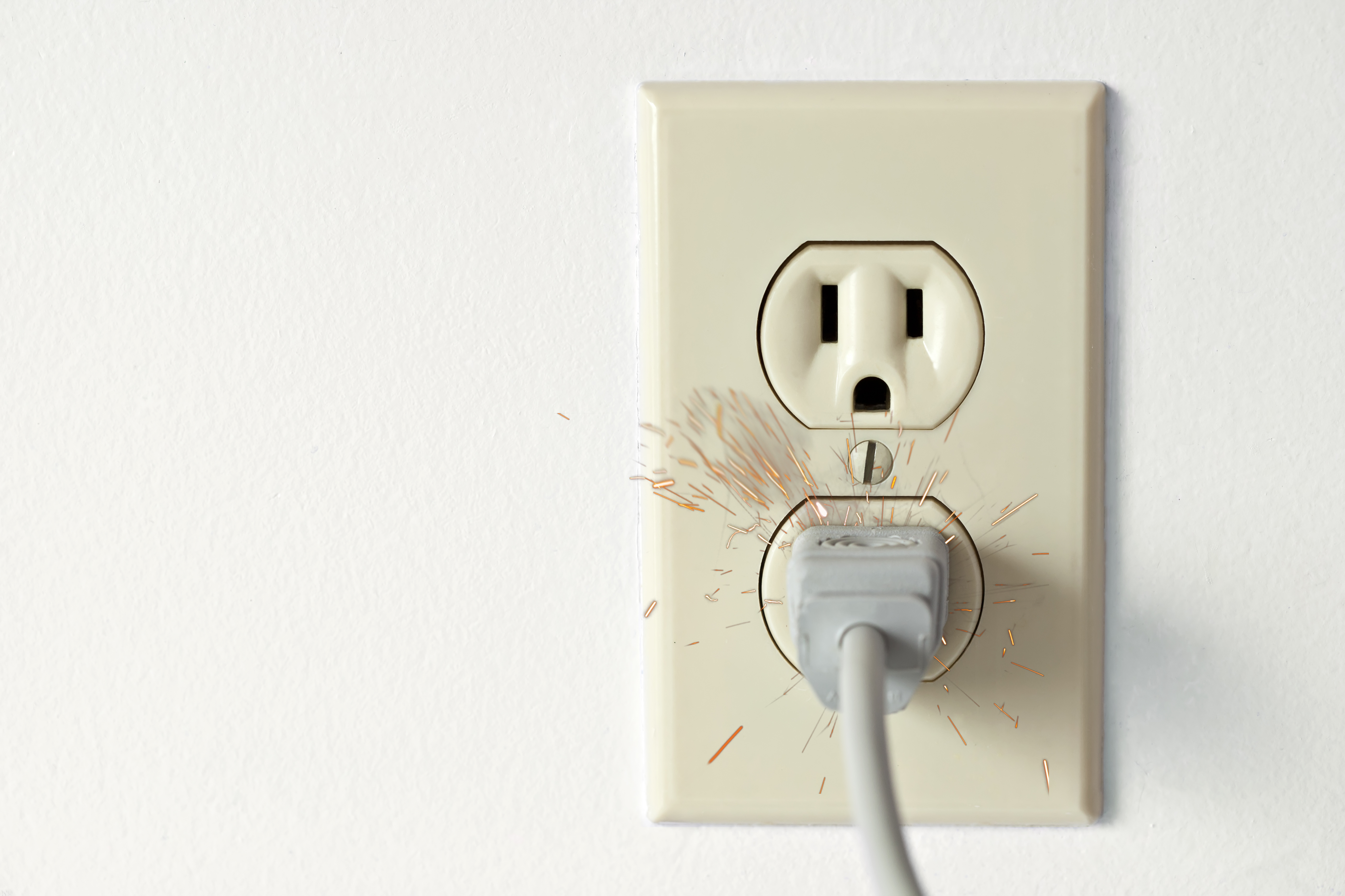 What causes an outlet to spark?